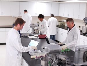 A group of researchers at work in a lab. 